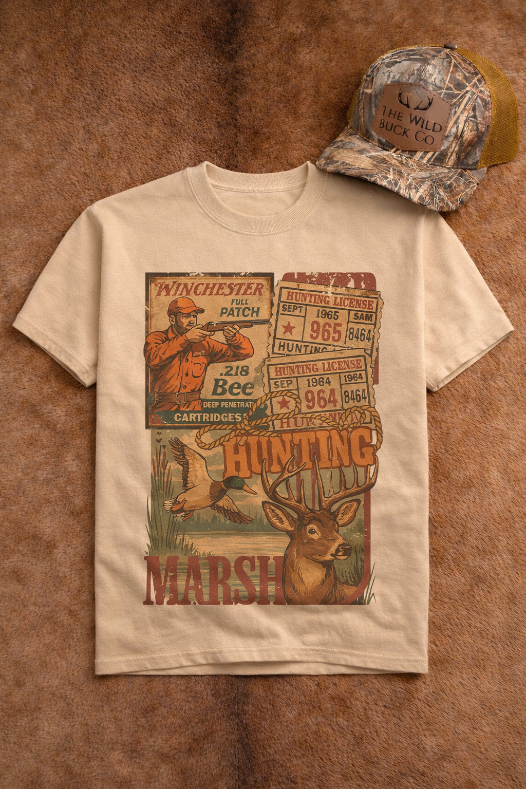 Beige t-shirt with hunting-themed graphic and camouflage cap on a brown background